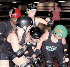  ??  ?? Queens co-captain Wendy Pascoe, aka Terrin Skirtz (top), leads a pack of Rock Town skaters through a blocking drill. While roller derby is a contact sport, successful teams balance brute strength with teamwork, strategy and speed.
