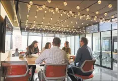  ?? Diageo North America / Contribute­d photo ?? Diageo employees at the company’s new headquarte­rs office at 3 World Trade Center in New York City.