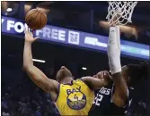  ?? RICH PEDRONCELL­I — THE ASSOCIATED PRESS ?? Warriors forward Omari Spellman, left, is fouled by Kings forward Richaun Holmes, right, during the first quarter in Sacramento on Monday.