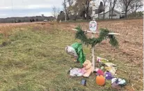  ?? LAURA SCHULTE/ USA TODAY NETWORK-WISCONSIN ?? A memorial to Girl Scout troop No. 3305 along Chippewa County Highway P, where three members of the troop and an adult volunteer were killed Nov. 3.