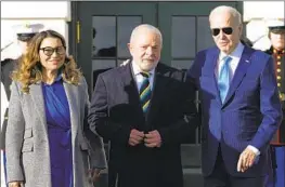  ?? Susan Walsh Associated Press ?? LULA’S WIFE, Rosangela da Silva, joins the presidents on the South Lawn. The Brazilian delegation also included Anielle Franco, the minister for racial equality.