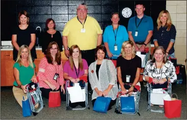  ?? CONTRIBUTE­D PHOTO ?? Teachers with Calhoun Pre-K stand with Farmers Insurance agent Mark Irwin, back row, center, along with donations they received as part of Farmers Insurance Thank a Million Teachers initiative.