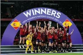  ?? JOSE BRETON — THE ASSOCIATED PRESS ?? Spain’s team captain Irene Paredes lifts the trophy after winning the Women’s Nations League final soccer match between Spain and France at La Cartuja stadium in Seville, Spain, Wednesday, Feb. 28, 2024. Spain won 2-0.