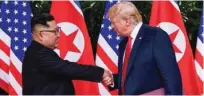  ?? - Reuters file photo ?? WARM GREETINGS: US President Donald Trump and North Korea’s leader Kim Jong Un shake hands during the signing of a document after their summit at the Capella Hotel on Sentosa island in Singapore.