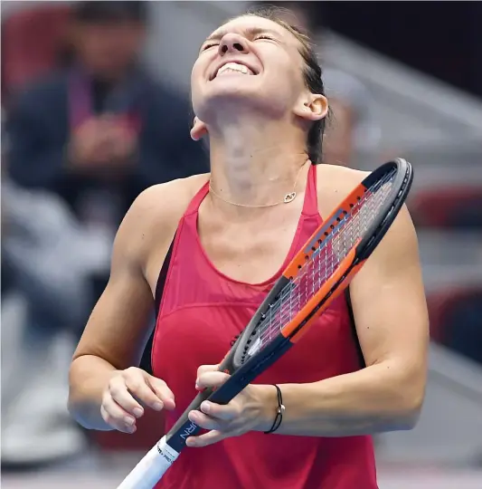  ?? PHOTO AFP ?? Simona Halep ne pouvait contenir sa joie après avoir défait Jelena Ostapenko dans un match qui lui aura valu le premier rang.