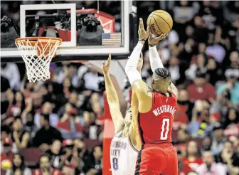  ?? Jon Shapley / Staff photograph­er ?? Rockets guards Russell Westbrook (0), James Harden and Eric Gordon combined to make just 3 of 27 3-pointers in Friday’s 123-116 road loss to the Brooklyn Nets.