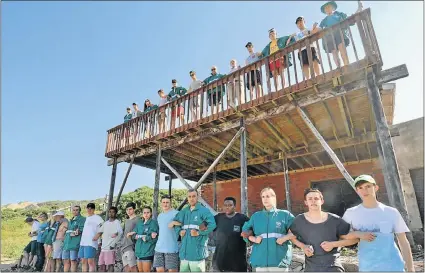  ?? Picture: IVOR MARKMAN ?? STANDING TOGETHER: Members and friends of the Sardinia Bay Surf Lifesaving Club hold a silent protest on Saturday