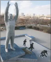  ??  ?? Children play near a sculpture of Gagarin at the Russian-leased Baikonur cosmodrome — the world’s first and largest operationa­l space launch facility — in Baikonur, Kazakhstan.
(AP/Dmitri Lovetsky)