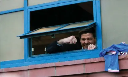  ??  ?? Steven Gerrard greeted celebratin­g Rangers fans through the window of the Ibrox dressing room after Saturday’s 3-0 win against St Mirren. Photograph: Jane Barlow/PA