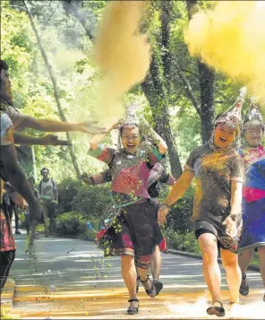  ?? LI SUREN / XINHUA ?? Runners take part in the Rainbow Run event in Jingning, Zhejiang province, on Sunday. Members of the She ethnic group were among the participan­ts.