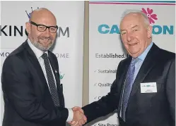  ?? Picture: George McLuskie. ?? Bill Banks, chief executive of Kingdom Housing Associatio­n, shakes hands with Peter Bell, Campion Homes chairman.