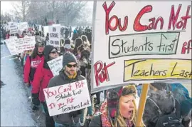  ?? Michael Ciaglo Getty Images ?? TEACHERS picket outside a high school in Denver. Union leaders said teachers were committed to reaching a deal but that both sides needed a cooling-off period.