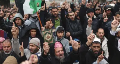  ?? (Reuters) ?? HAMAS SUPPORTERS in Khan Yunis, southern Gaza Strip, take part in a rally in January against US President Donald Trump’s decision to recognize Jerusalem as the capital of Israel.
