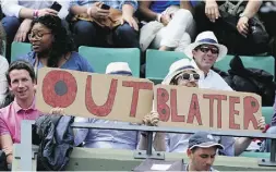  ?? David Vincent / The Associated Pres ?? Spectators at the French Open in Paris on Tuesday
urge Sepp Blatter to quit.