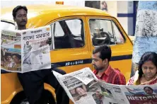  ?? AP Photo ?? Indians read newspapers in many local languages, but that diversity may slowly become a thing of the past