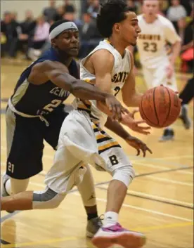  ?? PETER LEE, RECORD STAFF ?? Saints’ Zubair Seyed, right, dribbles around Toronto Central Tech Blues’ Steven Rwahwire in exhibition basketball action at St. Benedict Catholic Secondary School in Cambridge on Thursday night. The Toronto squad won, 59-57.