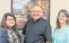  ?? CONTRIBUTE­D/ JOURNAL PIONEER ?? Lauren van Vliet, from left, Bishop Richard Grecco, and Jennifer Scott the Diocesan receptioni­st and administra­tive assistant.