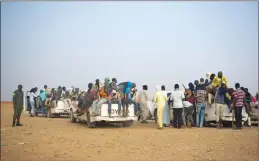  ?? AP PHOTO JEROME DELAY ?? Nigeriens and third-country migrants head towards Libya from Agadez, Niger on Monday, June 4. Migrants from across sub-Saharan African — Mali, the Gambia, Guinea, Ivory Coast, Niger and more — are part of the mass migration toward Europe, some fleeing violence, others just hoping to make a living.