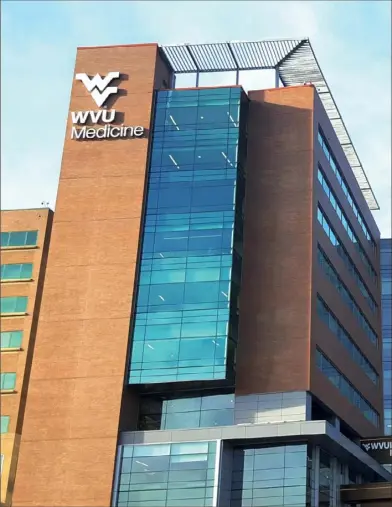  ?? WVU Medicine ?? WVU Medicine’s patient tower at Ruby Memorial Hospital in Morgantown, W.Va. WVU Medicine is part of a partnershi­p to lower the cost of kidney disease care while hoping to improve patient outcomes.