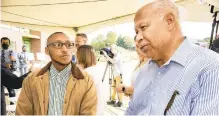  ?? ?? Joshua Robinson, left, a son of the late John Robinson, who owned the property The Mill of Easton sits on, listens as Marvin Boyer speaks Friday. Robinson and Boyer, both members of the NAACP Easton area branch, said the project was John Robinson’s dream and it will enhance the city’s South Side.