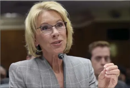  ?? SUSAN WALSH — THE ASSOCIATED PRESS FILE ?? In this file photo, Education Secretary Betsy DeVos testifies on Capitol Hill in Washington. Two women who claim they were defrauded by a New York for-profit college are suing the Education Department and a private lender in a case their lawyers hope...