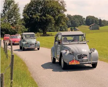  ??  ?? Above: Authentic Category winners Mark and Jane Smith (FMR Tg500) had incurred just 3 secs of penalties after 10 days. Right: Ladies’ Team victors Patty Schwarze and Dorothy Dansberger are followed through the lanes of southern Germany by another Us-crewed 2CV, plus Austrian-entered Prinz and Steyr-puchs