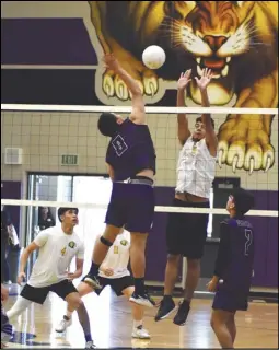  ?? MEGAN WIDICK Special to the Valley Press ?? Eastside’s Adrian Vasquez goes up for a kill as Knight’s Erik VillamarTe­odoro tries to defend during the Golden League finale for both teams on Thursday at Eastside High School. The Lions won in straight sets.