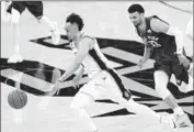  ?? Eric Gay Associated Press ?? SAN ANTONIO guard Derrick White drives past Denver guard Jamal Murray during Game 3.