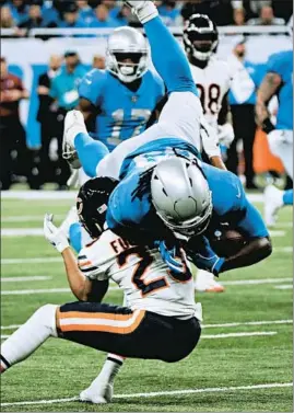  ?? JOHN J. KIM/CHICAGO TRIBUNE ?? The Lions’ LeGarrette Blount, being tackled by Kyle Fuller on a 27-yard run during the fourth quarter Thursday, did a lot of his damage when Khalil Mack was on the sideline.