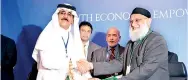  ??  ?? Amãna Bank Chairman Osman Kassim exchanging agreements with ICD CEO Khaled Al Aboodi at the recent 42nd Annual Meeting of IDB Governors in Jeddah.