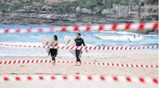  ?? FOTO: BAI XUEFEI/DPA ?? Sport auf Abstand: Bondi Beach am Dienstag.