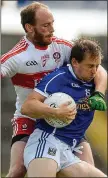  ??  ?? HALTED: Seanie Johnston is held by Derry’s Ciarán Mullan