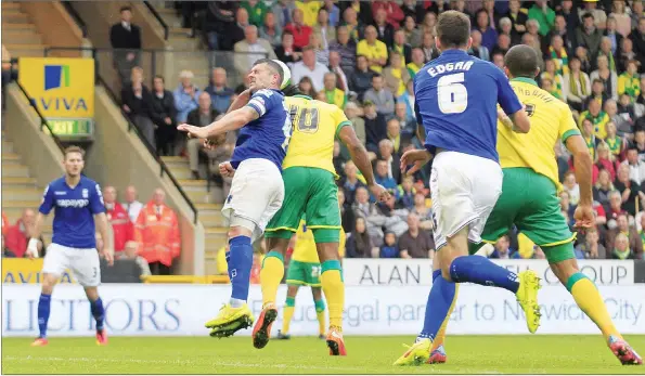  ?? PICTURES: Action Images ?? HEAD-HUNTER: Norwich’s Cameron Jerome, partly obscured, heads in their second goal despite some close attention