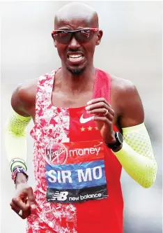  ??  ?? Mo Farah finishes the men’s elite race at the London Marathon in central London. — Reuters photo