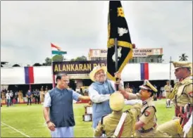  ?? ANI ?? Union home minister Amit Shah with Assam chief minister Himanta Biswa Sarma presents the President's Colour to Assam Police during a programme in Guwahati on Tuesday.