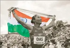  ?? AP ?? Hima Das celebrates after her victory in women's 400 metres race at the 2018 IAAF World U20 Championsh­ips in Tampere, Finland, July 12