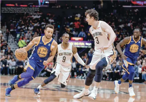  ??  ?? Golden State Warriors guard Stephen Curry (30) drives past New Orleans Pelicans centre Omer Asik (3) during the second quarter at the Smoothie King Center.
— USA Today Sports