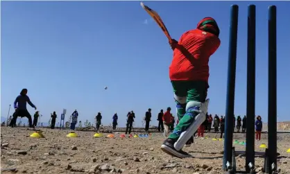  ??  ?? Afghan girls play cricket on the grounds of a school in Herat in 2014. Photograph: Aref Karimi/AFP/Getty Images