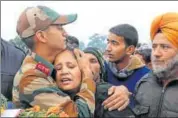 ?? PTI/FILE ?? The son and wife (C) of JCO Madan Lal Choudhary, who was martyred in the militant attack on the Sunjuwan army camp in Hiranagar near Jammu, mourn his death