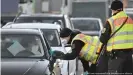  ??  ?? German police are now also checking individual­s arriving by car