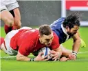  ??  ?? Wales' George North scores their first try against France