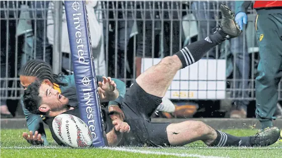  ??  ?? New Zealand’s Nehe Milner-Skudder scores a try against South Africa.