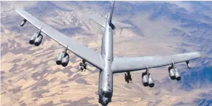  ?? ( Reuters) ?? A B- 52 Stratofort­ress prepares for refueling over Afghanista­n during a close- air- support mission in this undated handout photo.