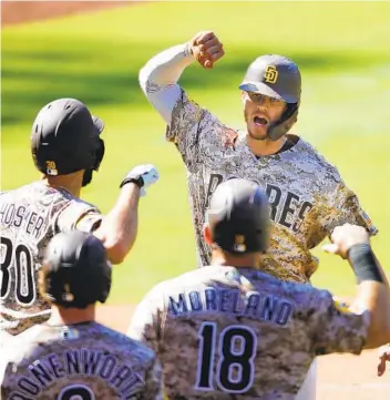  ?? K.C. ALFRED U-T ?? Wil Myers celebrates a three-run home run in the sixth inning against the Mariners at Petco Park on Sunday.