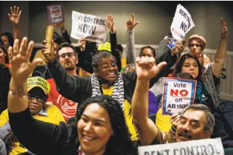  ?? Gabrielle Lurie / The Chronicle ?? Activists express their opinion during a January legislativ­e hearing on whether to repeal the Costa-Hawkins law, which limits the amount of control localities can impose on rents.