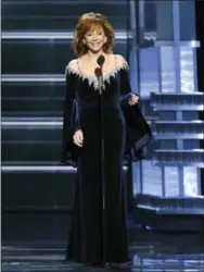  ?? PHOTO BY CHRIS PIZZELLO — INVISION — AP ?? Host Reba McEntire speaks at the 53rd annual Academy of Country Music Awards at the MGM Grand Garden Arena on Sunday in Las Vegas.
