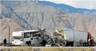  ?? PHOTO: REUTERS ?? Investigat­ors confer at the scene of a mass casualty bus crash near Palm Springs, California.