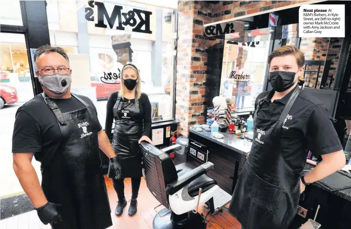  ??  ?? Next please At K&M’s Barbers, in Kyle Street, are (left to right) owner Mark McCrorie with Amy Jackson and Callan Gray