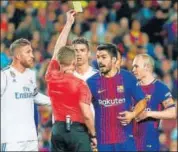  ?? AFP ?? Referee Alejandro Hernandez shows yellow card to Luis Suarez.