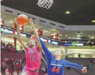  ?? ROBERTO E. ROSALES/JOURNAL FILE ?? New Mexico’s Shaiquel McGruder (13), shown driving to the basket against Boise State last February, says she made good use of her quarantine time in Utah.